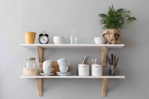 Shows how shelving can be cute and practical when decorating a model apartment.