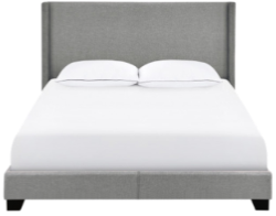 Image of bed with gray headboard