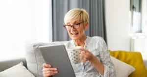 Photo of a senior female browsing on tablet