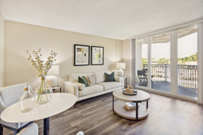 modern designed living room with white couch and round coffee table